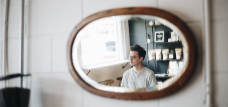 Reflection of person in a mirror